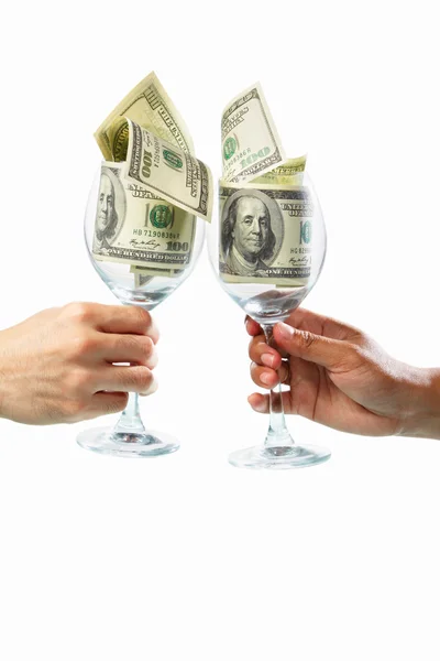 Toast using glass filled with dollar bills — Stock Photo, Image