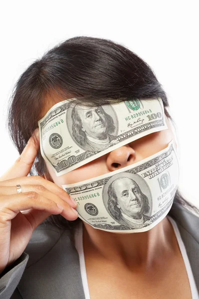 Businesswoman being blinded with money — Stock Photo, Image