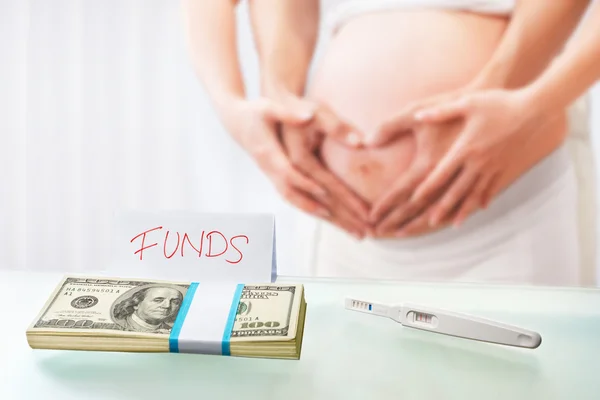 Funds for pregnancy Stock Image