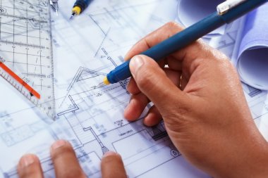 Architect working on house deisgn clipart