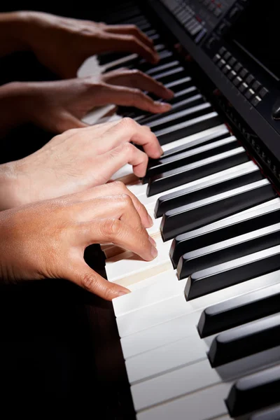 Playing digital hybrid piano — Stock Photo, Image