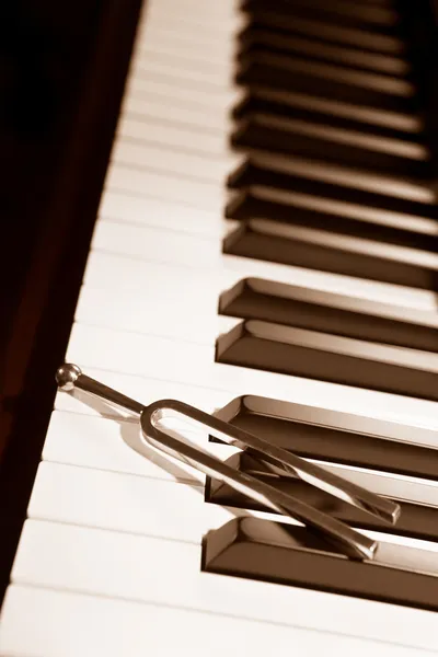 Piano and tuning forl — Stock Photo, Image