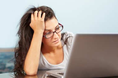 Depressed lady in front of laptop clipart