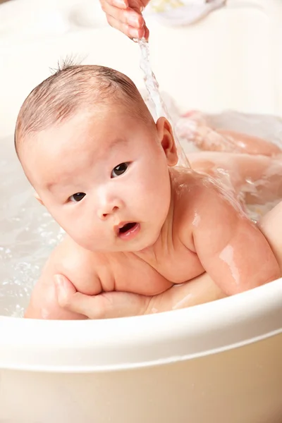 Baby being bathed — Stock Photo, Image