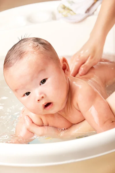 Baby being bathed — Stock Photo, Image