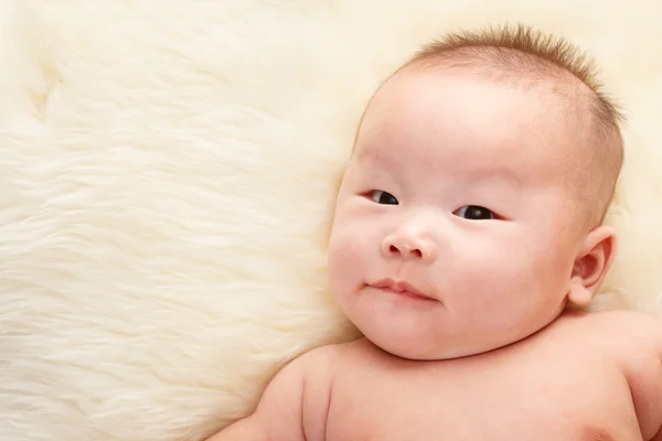 Chinese baby face smirking — Stock Photo, Image