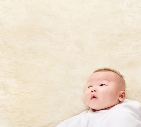 Chinese baby looking up to empty space — Stock Photo, Image
