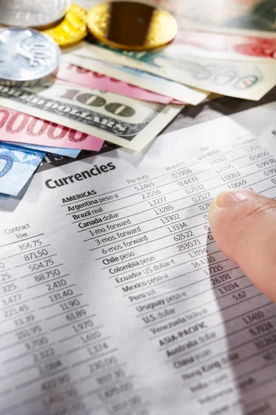 Observing foreign exchange sheet — Stock Photo, Image