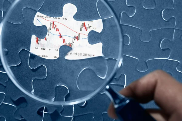 Jigzaw puzzle and economic graph — Stock Photo, Image