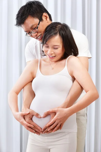 Couple showing love over their unborn child — Stock Photo, Image