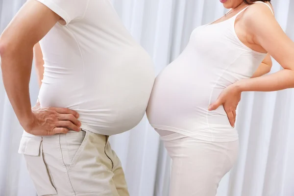 Pregnant lady being playful with her husband — Stock Photo, Image