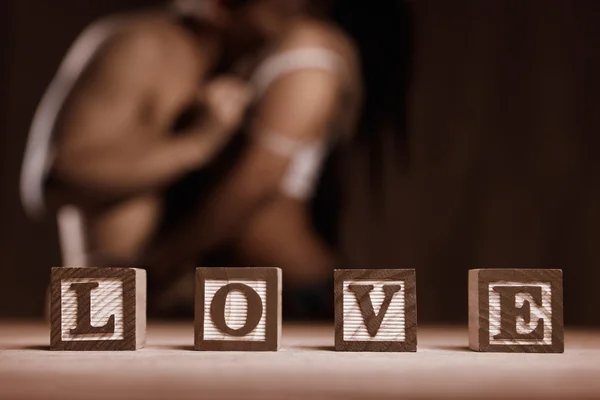 Stock image Word LOVE and couple