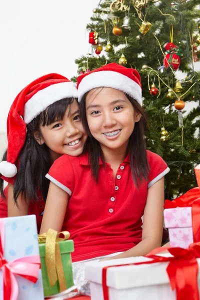 Lovely sibling with Christmas outfit Stock Photo