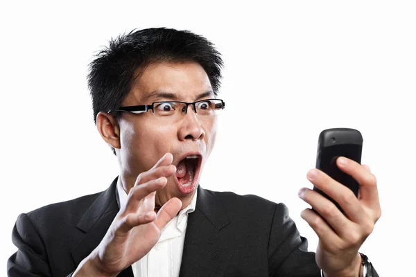 Бизнесмен удивил выражение лица при использовании видеозвонка — стоковое фото