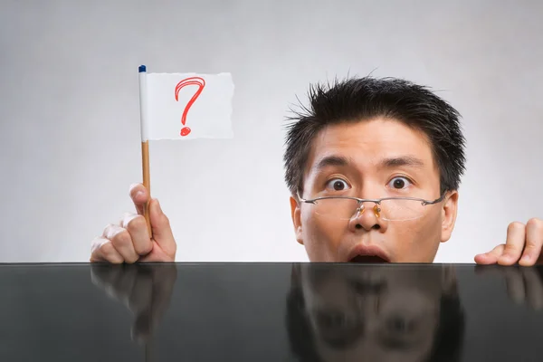 Man holding question mark flag — Stock Photo, Image