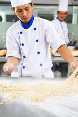 Chef making noodle clipart