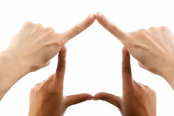 Multi ethnic hands forming house symbol — Stock Photo, Image