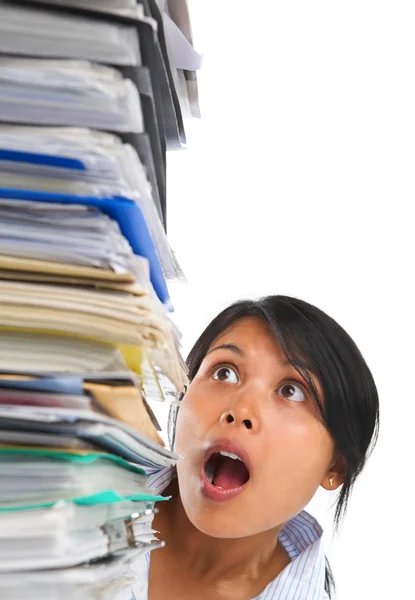 Asian lady surprised by high pile of paperwork — Stock Photo, Image