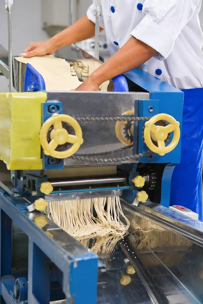 stock image Using machine to make noodle