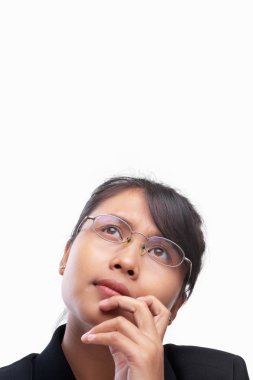 Young Asian businesswoman in contemplate looking up the blank sp clipart