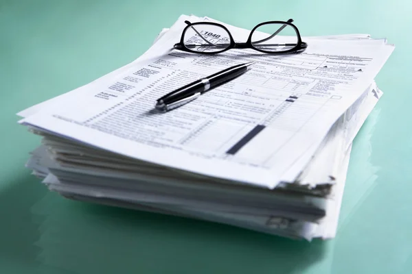 Pile of documents and tax form — Stock Photo, Image