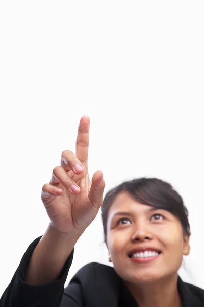 Joven mujer de negocios asiática apuntando con el dedo índice al spa en blanco —  Fotos de Stock