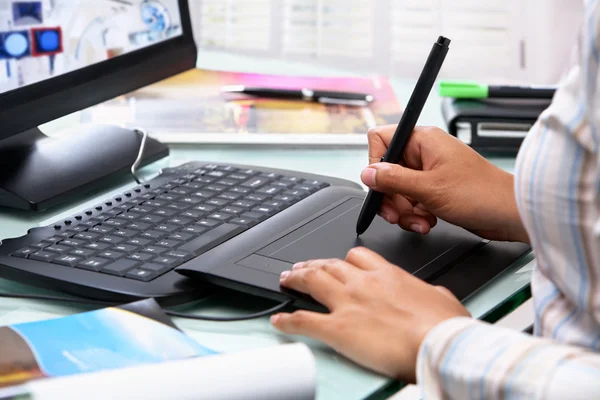 Female graphic designer using tablet pen — Stock Photo, Image