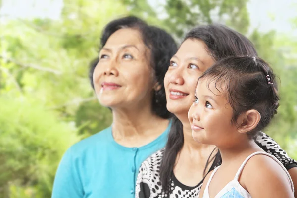 Three Asian female generations looking away — Stock Photo, Image