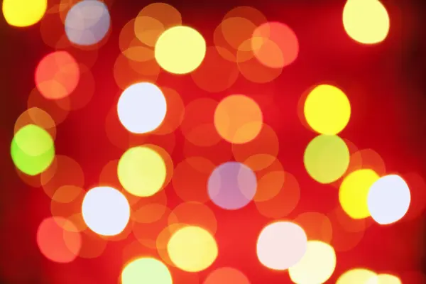 Christmas lamp arranged on red background — Stock Photo, Image