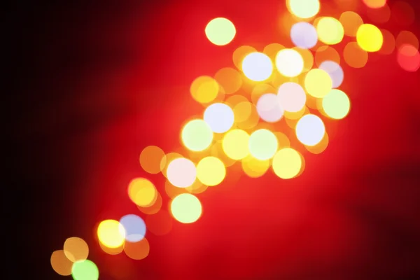 Christmas lamp arranged on red background — Stock Photo, Image