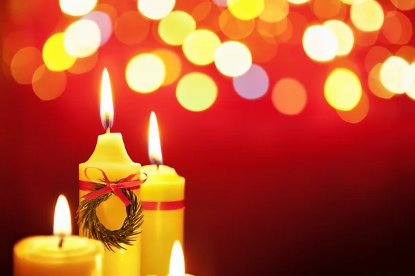 Christmas candle with blurred light — Stock Photo, Image