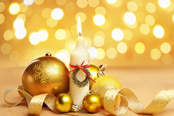 Golden Christmas ornament and candle with blur light — Stock Photo, Image