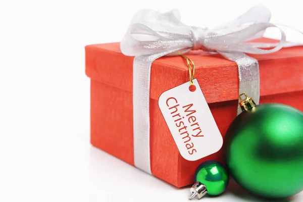 Christmas present with tag — Stock Photo, Image