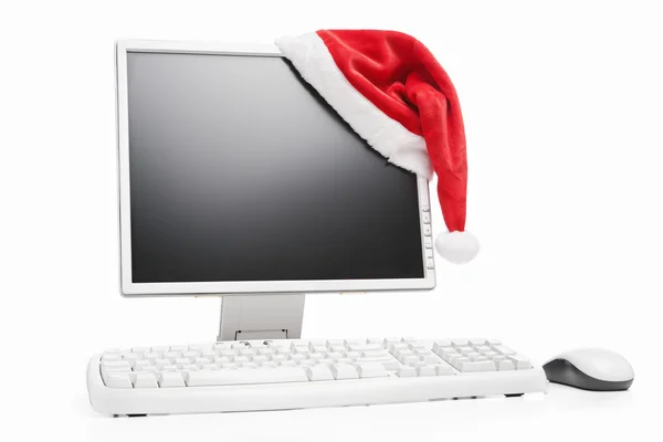 Komputer i santa hat — Zdjęcie stockowe