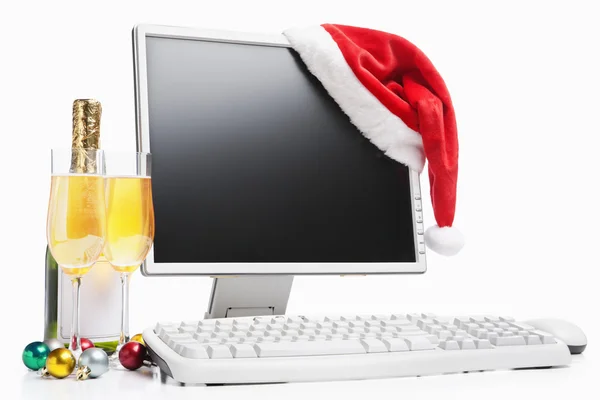 コンピューター、シャンパン、サンタの帽子 — ストック写真