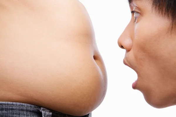 Man surprised looking on big belly — Stock Photo, Image