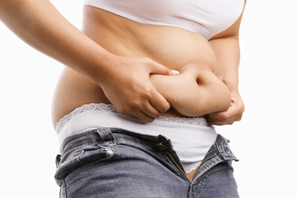 Mulher gorda beliscando sua barriga gorda — Fotografia de Stock