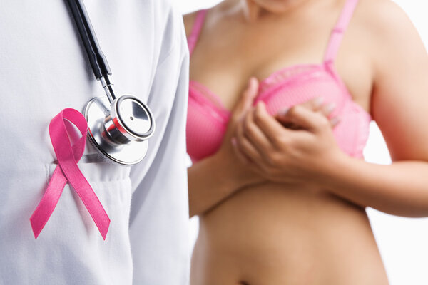 Doctor with pink badge and woman on bra