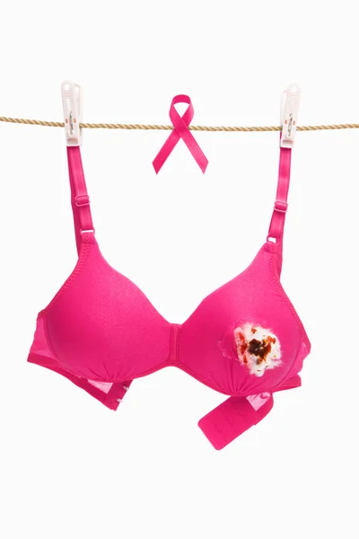 Broken pink bra with ribbon for breast cancer concept — Stock Photo, Image