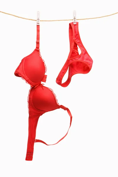 Woman's red underwear hanging on rope — Stock Photo, Image