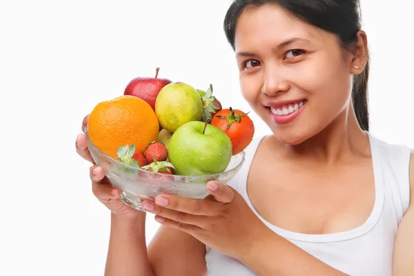 Asian woman holding bowl of fruits — Stock Photo, Image