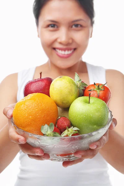 Asian woman holding bowl of fruits — Stock Photo, Image