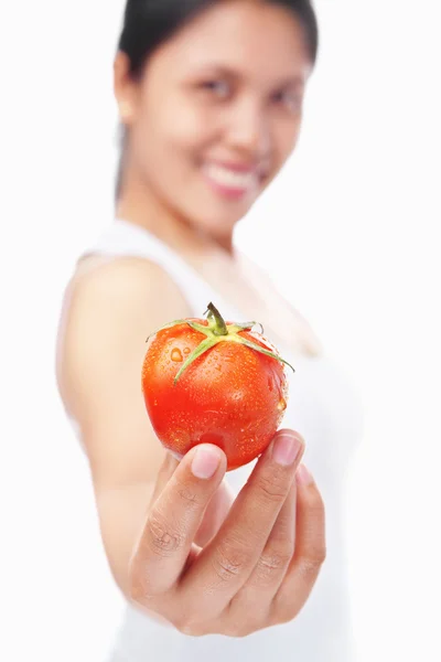 Woman holding tomato — Stock Photo, Image