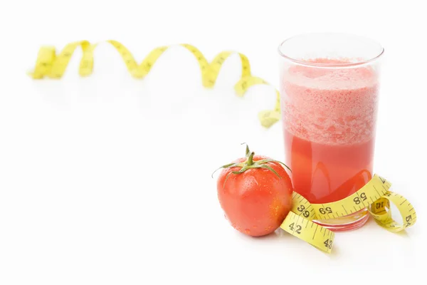 Tomato and juice with measuring tape — Stock Photo, Image