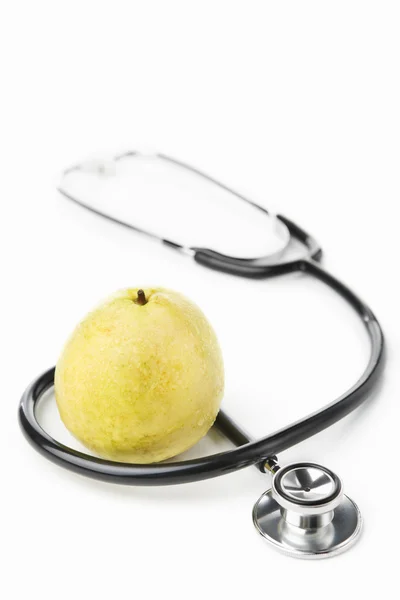 Stethoscope and guava over white — Stock Photo, Image