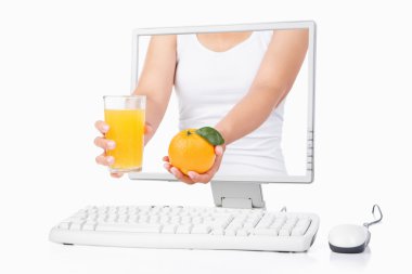 Female hand holding orange and juice coming out from computer sc clipart