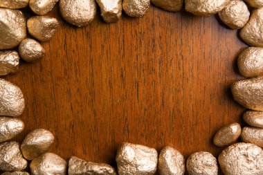 Wood framed by golden nuggets clipart