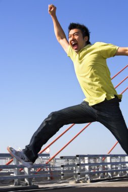 Young man jumping freely with blur movement clipart