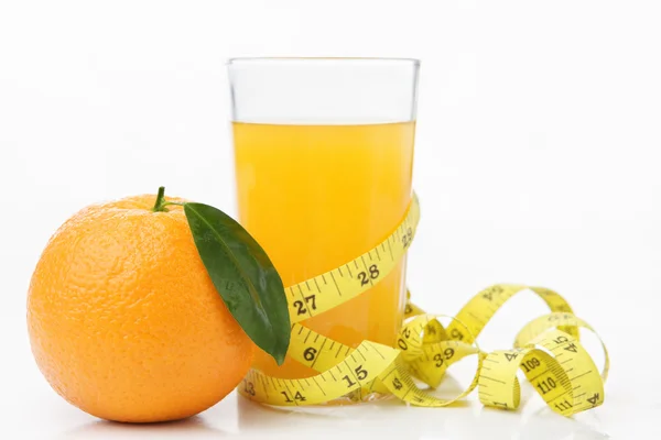 Orange and juice with measuring tape — Stock Photo, Image