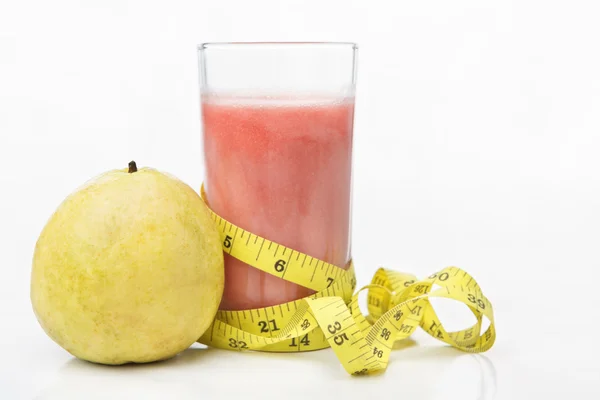 Guava and juice with measuring tape — Stock Photo, Image